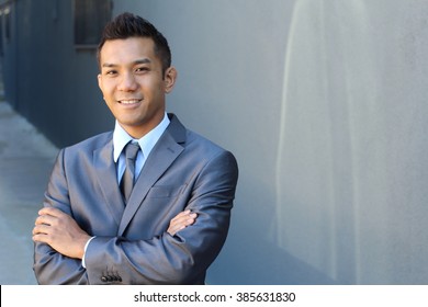 Portrait of a confident Asian lawyer outside