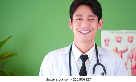 Portrait Of Confident Asian Young Male Physician Smile, Posing In Hospital Medical Office. Expertise, Professional Doctor Therapist In Uniform White Lab Coat And Stethoscope.