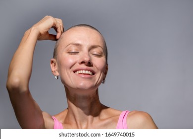 Portrait Confident Beautiful Happy Young Bald Woman On Gray Background Wall