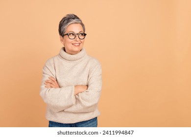 Portrait of confident business woman senior lady expert in sales management looking her interns ideas isolated on beige color background - Powered by Shutterstock