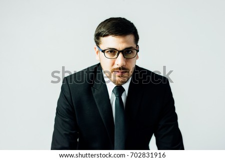 Portrait of a confident businessman on white background.