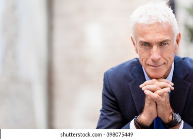 Portrait of confident businessman outdoors - Shutterstock ID 398075449