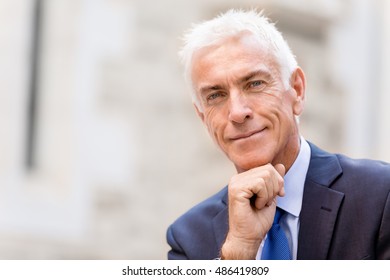 Portrait of confident businessman outdoors - Shutterstock ID 486419809