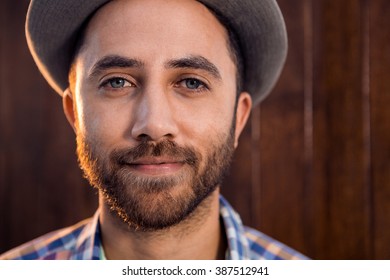 Portrait Of Confident Businessman Standing Against Wall