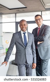 Portrait Of Confident Businessmen Standing Together In Office