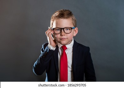 Portrait Of Confident Child Businessman With Phone In Hand. Leader. Back To School. Success, Creative And Innovation Education Concept. Rich And Finansial