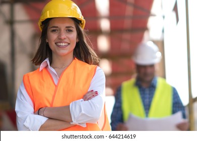 Portrait of confident female construction worker at construction site