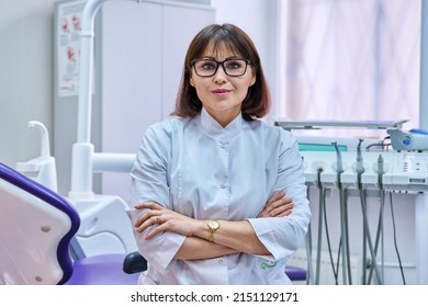 Portrait Of Confident Female Dentist Doctor In Office Looking At Camera