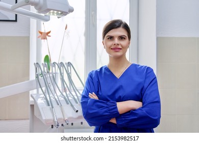 Portrait Of Confident Female Dentist Doctor In Office Looking At Camera