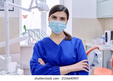 Portrait Of Confident Female Dentist Doctor In Office Looking At Camera