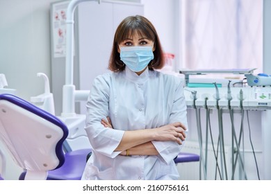 Portrait Of Confident Female Dentist Doctor In Office Looking At Camera