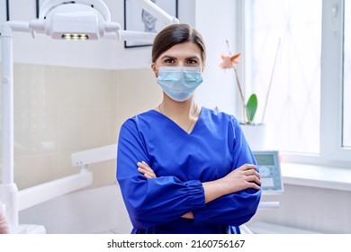 Portrait Of Confident Female Dentist Doctor In Office Looking At Camera