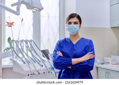 Portrait Of Confident Female Dentist Doctor In Office Looking At Camera