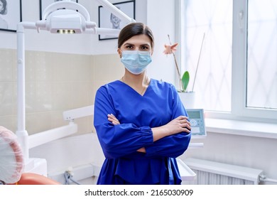 Portrait Of Confident Female Dentist Doctor In Office Looking At Camera