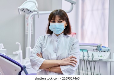 Portrait Of Confident Female Dentist Doctor In Office Looking At Camera