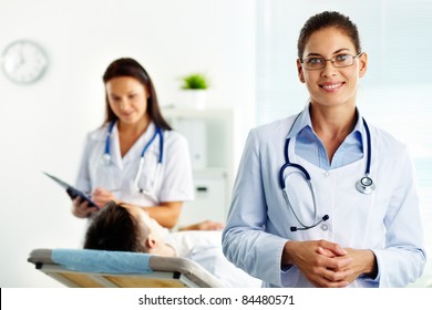 Portrait Of Confident Female Doctor Looking At Camera In Hospital