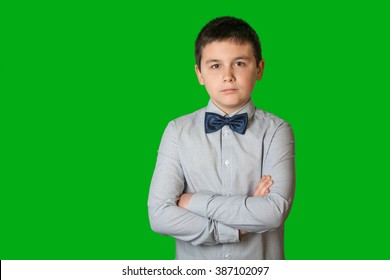 Portrait Of A Confident, Handsome, Young Man, Child, Arms Folded, On Green Screen 