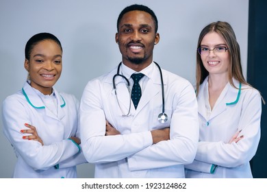 Portrait of confident happy group of doctors standing in medical office