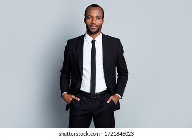 Portrait of confident intelligent afro american man marketer representative put hands pocket pants trousers ready decide successful solutions isolated over gray color background - Powered by Shutterstock