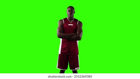 Portrait of confident male African American basketball player wearing red sports clothes, standing with his arms crossed looking at camera. Sports athlete strength - Powered by Shutterstock