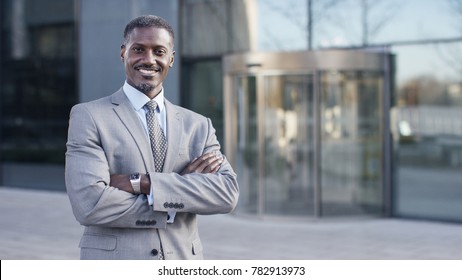 Portrait of confident male business man smiling to camera, with space for text