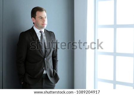 Portrait of a confident mature businessman standing outside