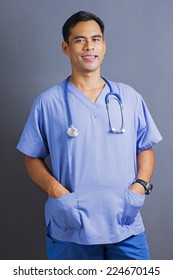 Portrait Of A Confident Mature Male Asian Nurse Or Doctor Isolated In White Background.