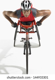 Portrait Of A Confident Paraplegic Cycler Against White Background