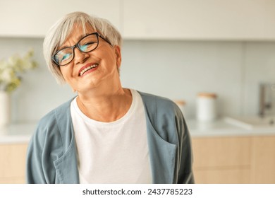 Portrait of confident stylish european middle aged senior woman. Older mature 60s lady smiling at home. Happy attractive senior female looking camera close up face headshot portrait. Happy people - Powered by Shutterstock