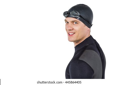 Portrait of confident swimmer in wetsuit on white background