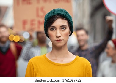 Portrait of confident woman in march fighting for freedom. Young latin woman empowerment strike on street. Casual girl in march to protest on equality rights. - Shutterstock ID 1761099722