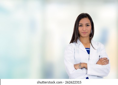 Portrait confident young female doctor medical professional standing in corridor isolated on hospital clinic hallway windows background. Positive face expression  - Powered by Shutterstock