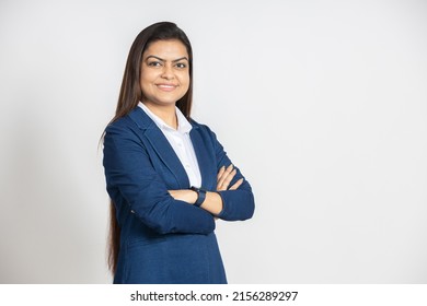 Portrait Of A Confident Young Indian Business Woman In A Suit Standing With His Arms Cross, Isolated On White Studio Background. Smiling Successful Asian Female Ceo Of Company, Executive Manager.