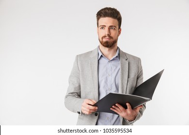 Portrait of a confident young man dressed in shirt and jacket holding folder isolated over white background - Powered by Shutterstock