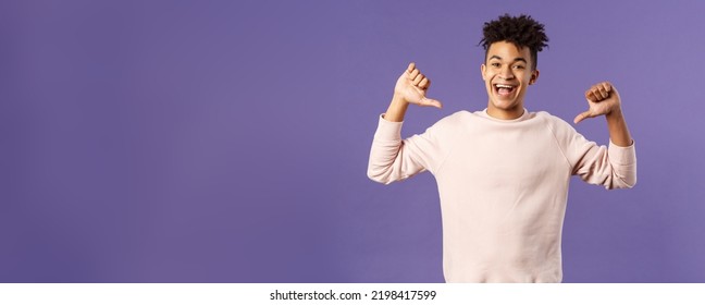 Portrait of confident young upbeat man, smiling bragging, being boastful about own accomplishments, indicate himself with proud rejoicing face, standing purple background - Shutterstock ID 2198417599