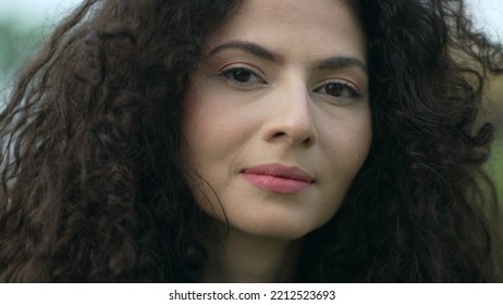 Portrait Of A Confident Young Woman In 30s Looking At Camera With Serious Expression Closeup Female Person