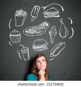 Portrait Of Confuse Young Woman Looking Up Thinking What To Eat. Fast Food Concept