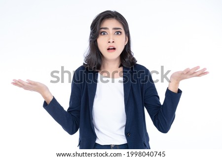 Portrait of confused and shocked young Asian business woman  shrugging feel baffled looking at camera isolated on white background. Doubt concept.