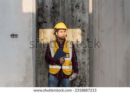 Portrait of construction architect inspecting construction work Serious civil engineer with documents on construction site professional foreman in the workplace