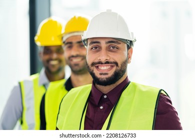 Portrait The Construction Crew Is Happy During The Meeting. Standing Lined Up In Construction Sizes. The Concept Was Successful. Team Work. Plan A Construction Project. Successful Workers.