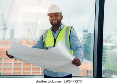 Portrait of Construction engineer working on building site in the office