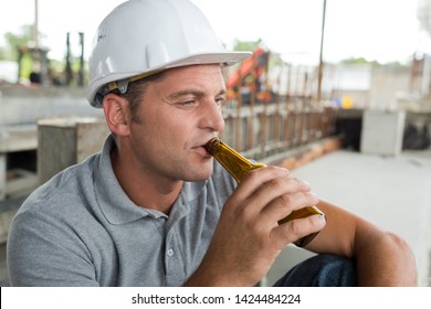 Portrait Of Construction Mason Worker Drinking Beer