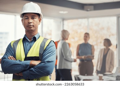 Portrait, construction worker and building with a man engineer standing arms folded in an architecture office. Industrial, mananger and leadership with a male architect working on a design project