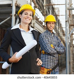 Portrait Of Construction Worker And Female Architect.