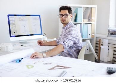 Portrait Of Contemporary Engineer Looking At Camera While Drawing Digital Plans In Office, Copy Space