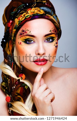 portrait of contemporary noblewoman with face art creative close