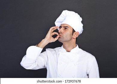 portrait-cook-over-dark-background-260nw-172937678.jpg