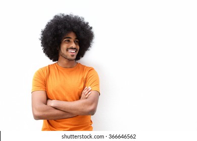 Portrait Of A Cool Black Guy Smiling With Arms Crossed Against White Background