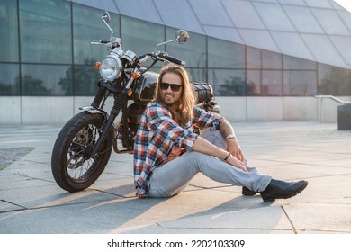 Portrait Of Cool Guy Biker With Sunglasses Sitting On Asphalt.