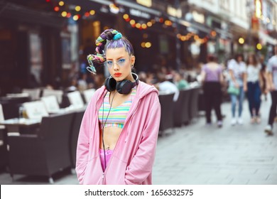 Portrait of cool hipster young woman with trendy eyeglasses and street style clothes in city street – Funky teenage girl with avant garde fashion hair – new generation lifestyle concept - Shutterstock ID 1656332575